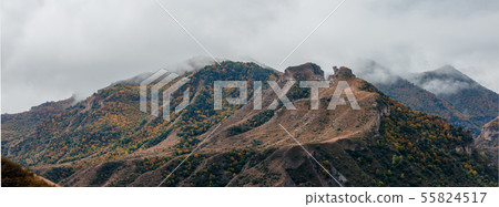Panoramic photo of picturesque mountain landscape with green vegetation with smog on summer 55824517