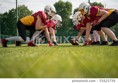 Image of female team playing rugby on playground 55825739