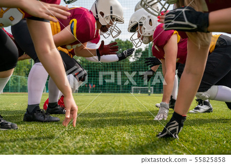 Photo of sportsmen playing american football on sports field Photo of sportsmen playing american football on sports field 55825858