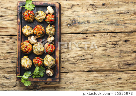 Mushrooms stuffed with vegetables Mushrooms stuffed with vegetables 55835978