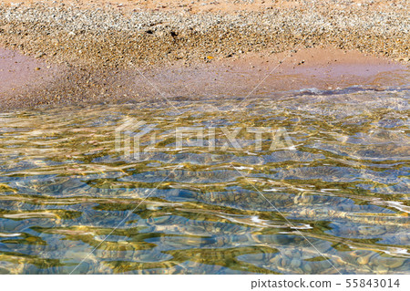 Pure calm sea water and coastline as background Pure calm sea water and coastline as background 55843014
