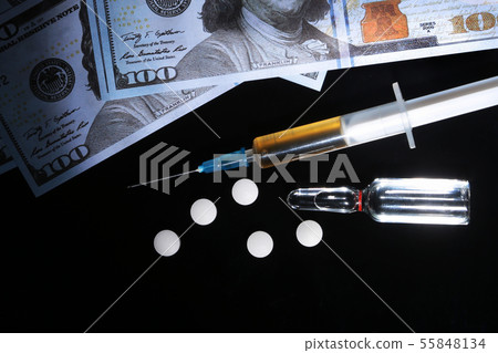 drug trafficking, crime, addiction and sale concept - closeup of with drugs and money. drug trafficking, crime, addiction and sale concept - closeup of with drugs and money. 55848134