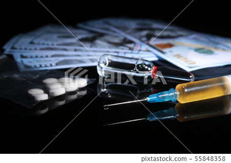 drug trafficking, crime, addiction and sale concept - closeup of with drugs and money. 55848358