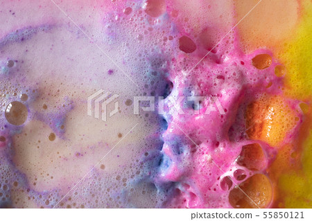 Foam of bath bomb close-up colorful top view Foam of bath bomb close-up colorful top view 55850121