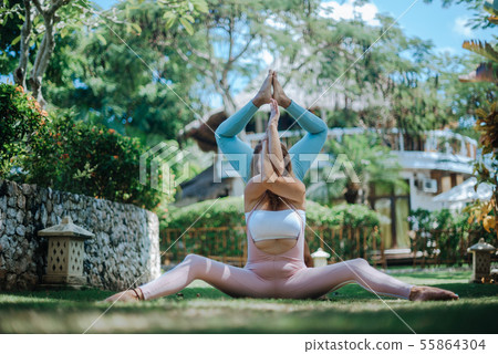 Pair of girls practice yoga 55864304