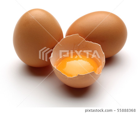 Broken chicken eggs with yolk isolated 55888368