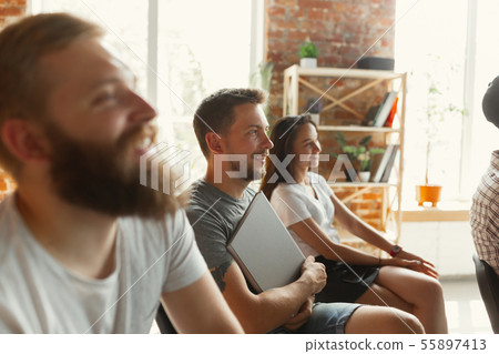 Students listening to presentation in hall at university workshop Students listening to presentation in hall at university workshop 55897413
