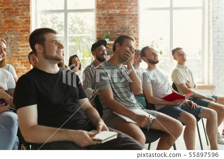 Students listening to presentation in hall at university workshop 55897596