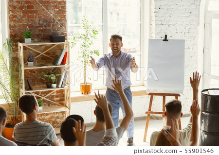 Male speaker giving presentation in hall at university workshop Male speaker giving presentation in hall at university workshop 55901546