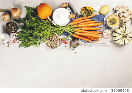 Healthy food cooking background. Fresh garden carrots, onions, pumpkins, ginger and spices on rustic 55909468