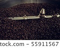 coffee beans in roast machine, arabica roasted 55911567