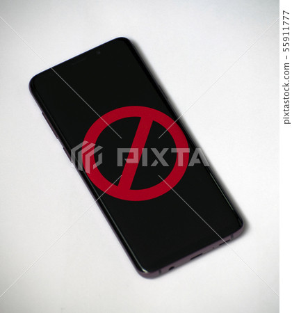 Red prohibition sign on the smartphone screen Red prohibition sign on the smartphone screen 55911777