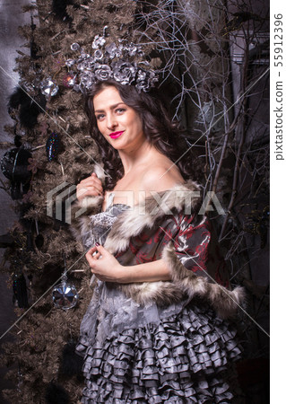 Christmas concept. Pretty woman in carnival dress. Christmas concept. Pretty woman in carnival dress. 55912396
