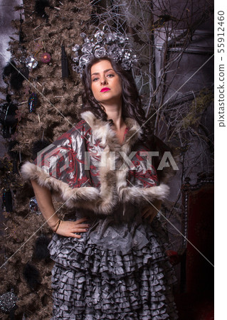 Christmas concept. Pretty woman in vintage dress. Christmas concept. Pretty woman in vintage dress. 55912460