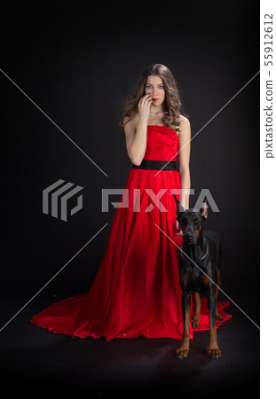 Lady in red with doberman Lady in red with doberman 55912612