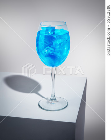Exquisite blue cocktail with ice-cubes Exquisite blue cocktail with ice-cubes 55912886