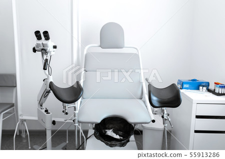 gynecological chair in a light gynecologist's 55913286