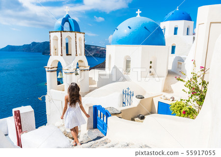 Santorini travel tourist woman on vacation in Oia 55917055