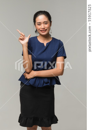 Businesswoman standing and thump up.. Businesswoman standing and thump up.. 55917825