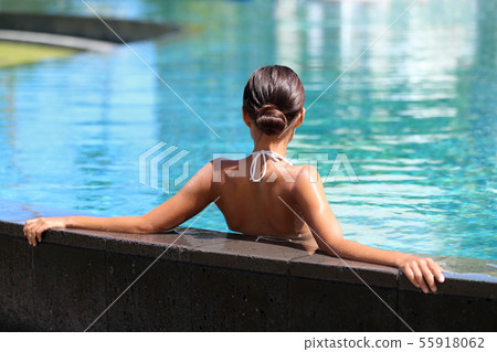 Swimming pool resort relaxation relaxing woman 55918062