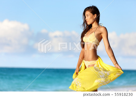 Sexy Asian bikini body woman relaxing in sunset Sexy Asian bikini body woman relaxing in sunset 55918230