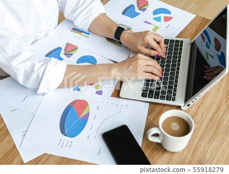 Business team work analyzing charts and graphs Business team work analyzing charts and graphs 55918279