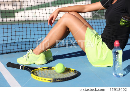 Tennis player woman resting drinking water Tennis player woman resting drinking water 55918402