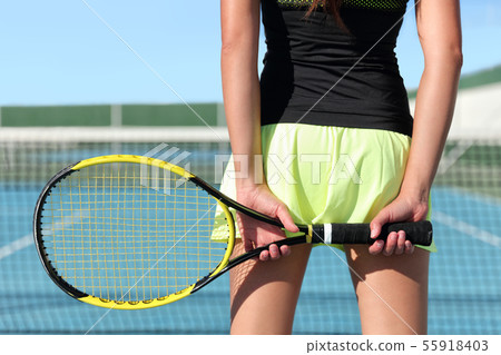 Tennis player holding racquet on outdoor court Tennis player holding racquet on outdoor court 55918403