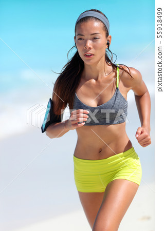 Running runner jogging training cardio on beach in sportswear 55918499