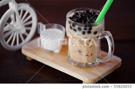 Ice bubble milk tea in takeaway glass. 55920855