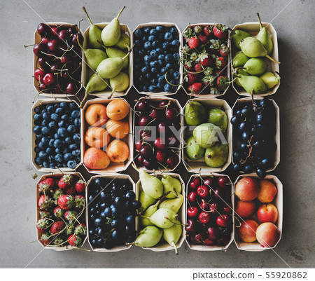 Summer fruit and berry assortment in wooden boxes 55920862