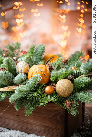 Christmas mood. Beautiful festive arrangement of fresh spruce in a rustic wooden box. Bokeh hearts Christmas mood. Beautiful festive arrangement of fresh spruce in a rustic wooden box. Bokeh hearts 55920960