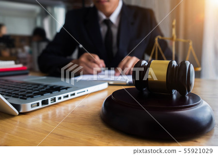 Male judge in a courtroom the gavel working. 55921029