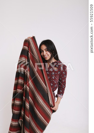 Asian girl covers her face with a handkerchief on 55921509