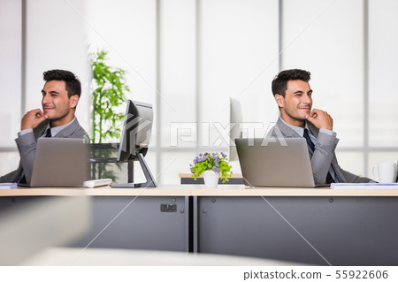 Businessman support the chin in modern office.. 55922606