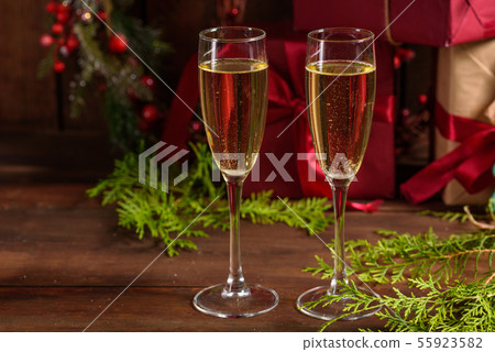 Christmas holiday table with glasses Christmas holiday table with glasses 55923582