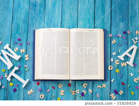 Open book on blue painted planks 55926929