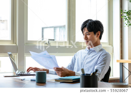 Businessman using a personal computer Businessman using a personal computer 55928067