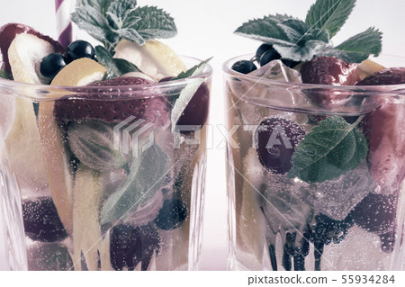 Homemade summer refreshing cocktail of fruits and berries. 55934284