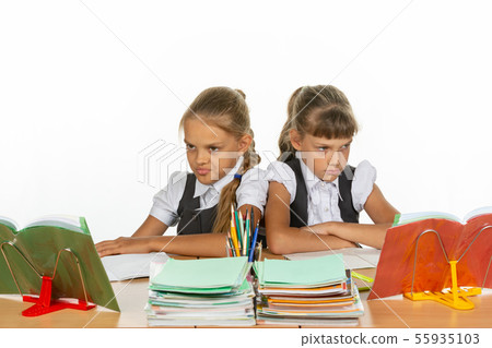 Two quarreling girls at the same desk 55935103