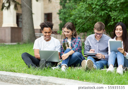 E-learning concept. Diverse students with devices in campus E-learning concept. Diverse students with devices in campus 55935535