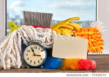 House cleaning items and alarm clock. 55936272