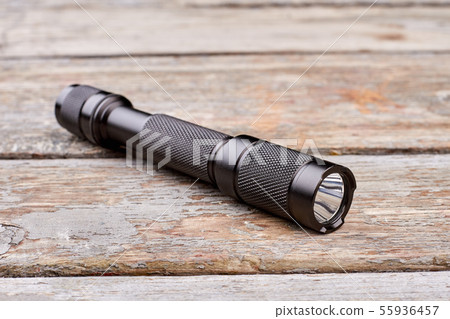 Black torch on wood. 55936457