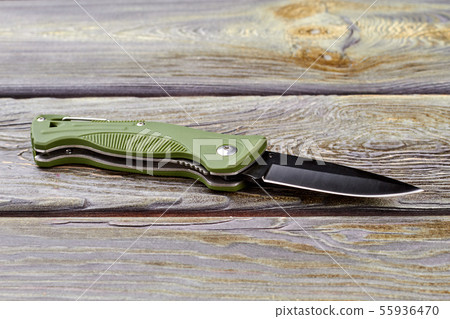 Jackknife on wood, close up. 55936470