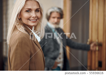 Joyful mature woman smiling outdoors stock photo 55936616