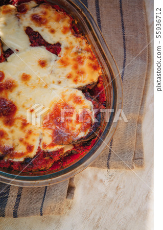 Eggplant alla Parmigiana Melanzane close up in baking dish. horizontal. Delicious eggplant alla Eggplant alla Parmigiana Melanzane close up in baking dish. horizontal. Delicious eggplant alla 55936712