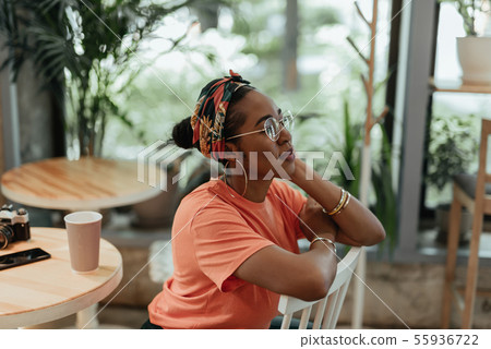 Young african american female in city cafe 55936722