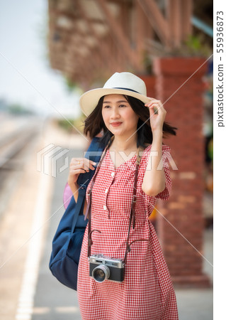 Asian women tourists at the train station. Asian women tourists at the train station. 55936873