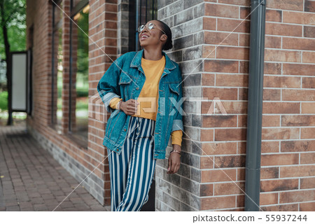 Young african american woman laugh at the street Young african american woman laugh at the street 55937244