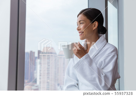 Hotel woman drinking morning coffee relaxing 55937328